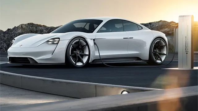 Porsche Taycan charging at sunset