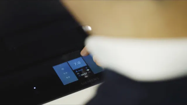 Finger operating a touch control panel