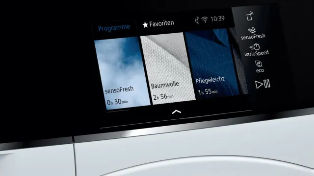 Touch display of a Siemens washing machine showing wash programmes
